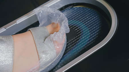 Automatic Thermal Shrinkable Shoe Cover Laminating Machine. Clos