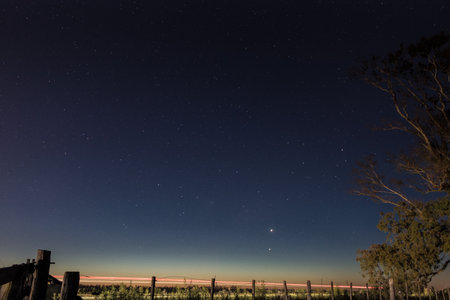 The gate, the cars and the starsの写真素材