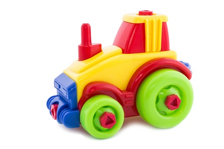 Toy a nursery plastic, a tractor wheel on a white background の写真素材