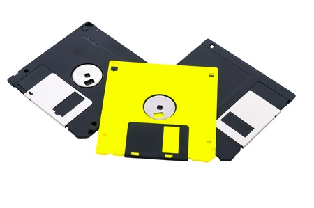Three diskettes, black and yellow, on a white background it is isolated.