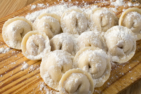 Pelmeni in soft illumination are powdered by wheat flour.の写真素材