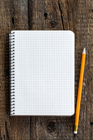 notepad on wooden tableの写真素材