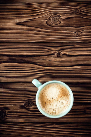 coffee cup on wooden background top viewの写真素材