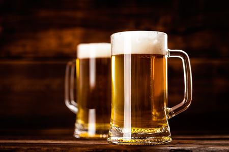 two glass mug of fresh beerの写真素材