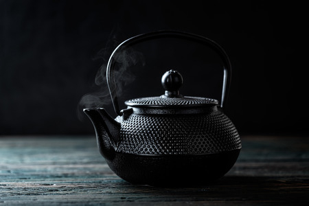 black cast iron teapotの写真素材