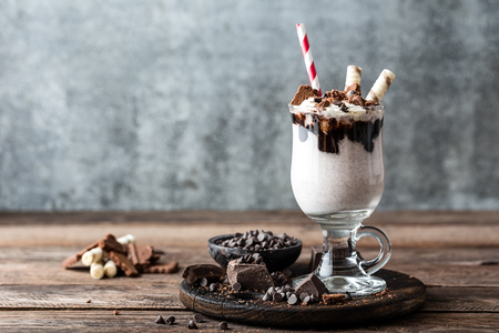 delicious milkshake with ice cream, chocolate and cookiesの写真素材