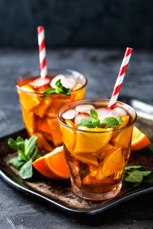 homemade flavored orange iced tea, refreshing summer beverageの写真素材