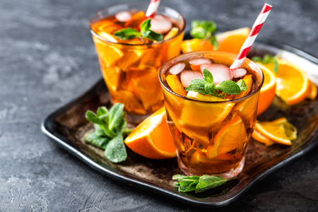 homemade flavored orange iced tea, refreshing summer beverageの写真素材