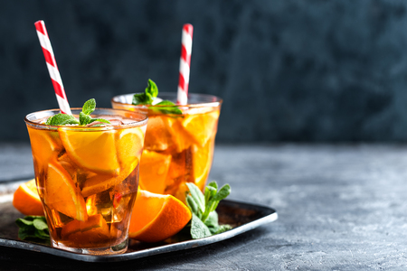 homemade flavored orange iced tea, refreshing summer beverageの写真素材