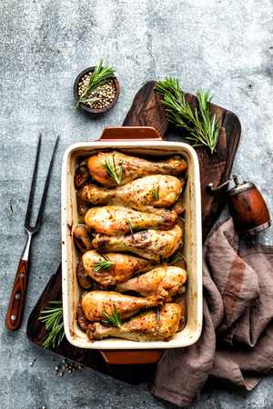 Baked chicken drumsticks in the ovenの写真素材