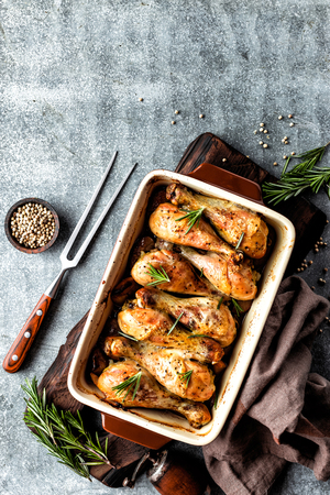 Baked chicken drumsticks in the ovenの写真素材