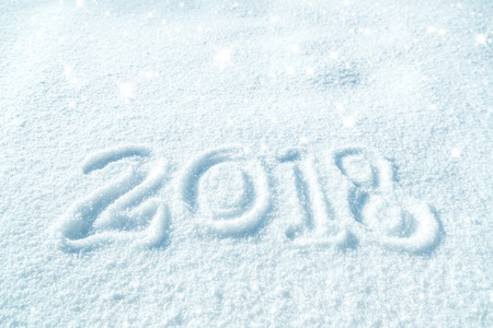 2018 written in natural shiny snowの写真素材