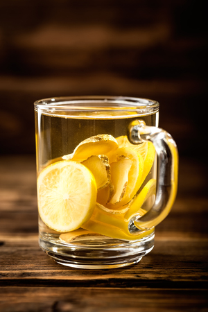 hot sweet ginger tea with lemon in glass mugの写真素材