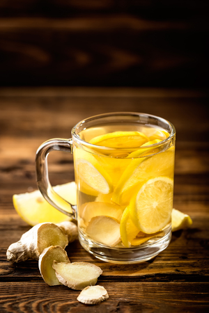 hot sweet ginger tea with lemon in glass mugの写真素材