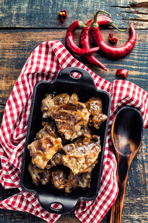 baked meat in cast iron dishの写真素材