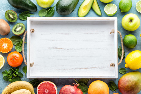 Top view of different selected juicy organic tropical fruits, super food, healthy eating concept, frame with blank space for a textの写真素材