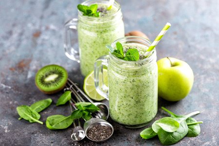 green smoothie with spinach, apple, kiwi, lime and chia seeds. healthy diet eating, superfoodの写真素材