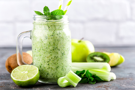 green smoothie with celery, apple, kiwi and lime. healthy diet eating, superfoodの写真素材