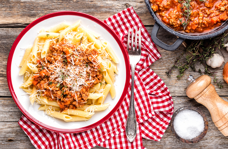 Pasta bolognese. Macaroni served with a classic Italian bolognese stew sprinkled with parmesan cheeseの写真素材