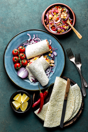 Burritos wraps with chicken meat and vegetables, traditional Mexican cuisine, fastfoodの写真素材