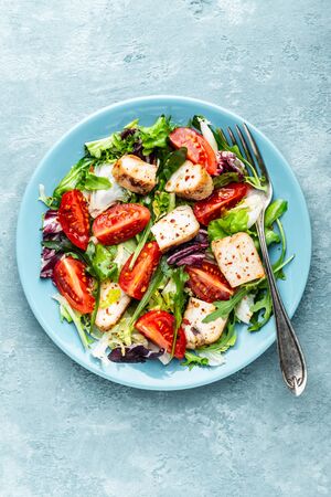 chicken breast salad with fresh vegetables top view and space for a textの写真素材
