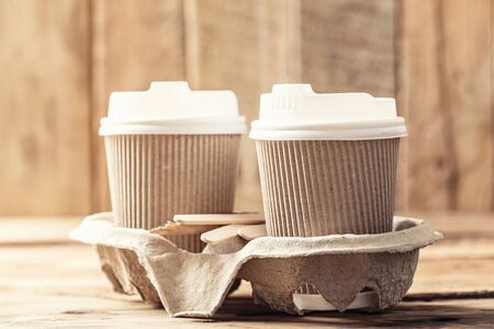 Coffee or tea in a paper cup with a lidの写真素材