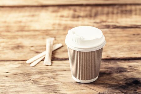 Coffee or tea in a paper cup with a lidの写真素材