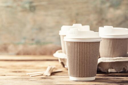 Coffee or tea in a paper cup with a lidの写真素材