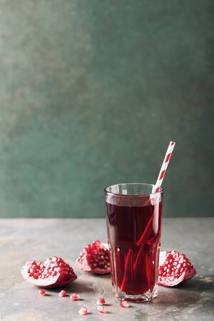 Natural pomegranate juice in a glassの写真素材