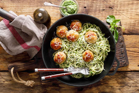 Pasta with meatballs and pesto sauceの写真素材