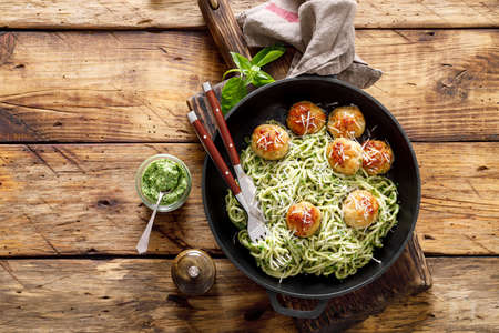 Pasta with meatballs and pesto sauceの写真素材