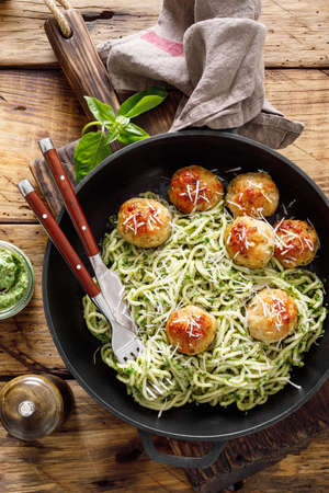 Pasta with meatballs and pesto sauceの写真素材