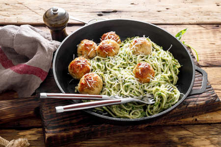 Pasta with meatballs and pesto sauceの写真素材