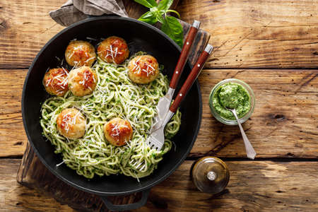Pasta with meatballs and pesto sauceの写真素材