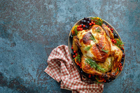 Roasted turkey or chicken for festive dinner for Thanksgiving or Christmasの写真素材