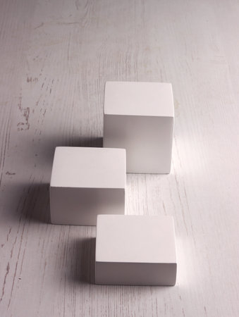 box mock up square photo product cube realistic white smart object packaging background board shadowの写真素材