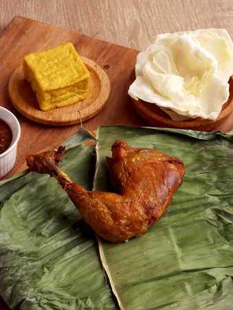 ayam goreng fried chicken indonesian homemade herbs asian plate cooking nasi food wood culinary hotの写真素材