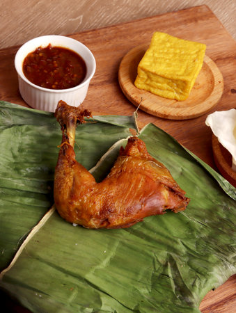 ayam goreng fried chicken indonesian homemade herbs asian plate cooking nasi food wood culinary hotの写真素材