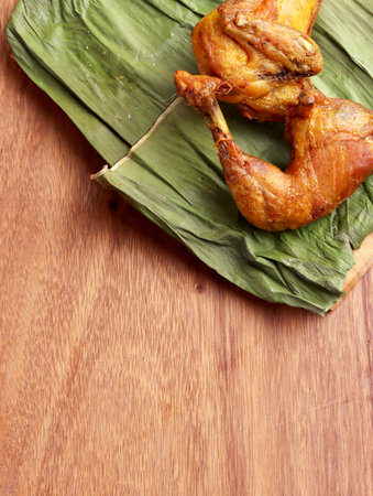 ayam goreng fried chicken indonesian homemade herbs asian plate cooking nasi food wood culinary hotの写真素材