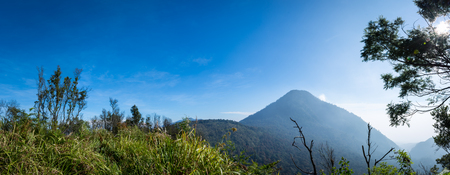 A panorama of Mount Papandayan landscape taken from Ghober Hut camp site with clear blue sky. Papandayan Mountain is one of the favorite place to hike on Garut.の写真素材