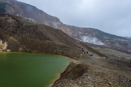 Small sulfur lake on active mountain. Beautiful landscape of mount Papandayan. Papandayan Mountain is one of the favorite place to hike on Garut.の写真素材