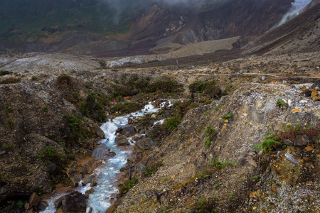 Rocky stream with white water on a mountain. Beautiful landscape of mount Papandayan. Papandayan Mountain is one of the favorite place to hike on Garut.の写真素材
