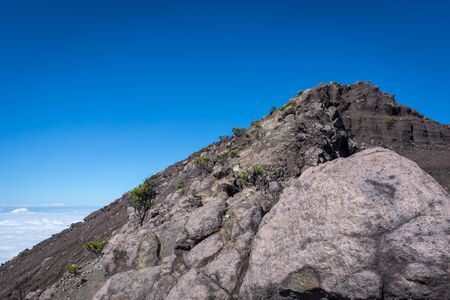 An extreme track to Raung mount summit called 'Puncak Sejati'. Raung is the most challenging of all Javaâs mountain trails, also is one of the most active volcanoes on the island of Java in Indonesia.の写真素材