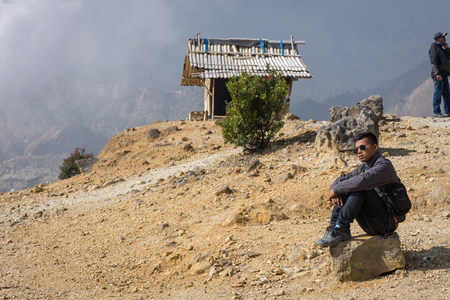 Garut, Indonesia - August 12, 2018 : A man are enjoying and hiking Papandayan Mountain. Papandayan Mountain is one of the favorite place to hike on Garut.のeditorial素材