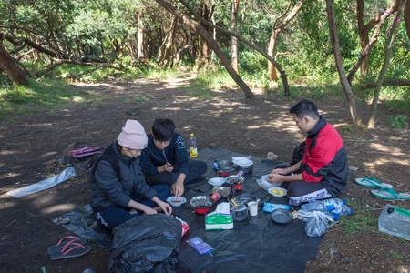 Garut, Indonesia - August 12, 2018 : A group of young people are camping and cooking on Papandayan Mountain. Papandayan Mountain is one of the favorite place to hike on Garut.のeditorial素材