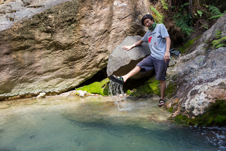 Garut, Indonesia - August 12, 2018 : A man are enjoying and hiking Papandayan Mountain. Papandayan Mountain is one of the favorite place to hike on Garut.のeditorial素材