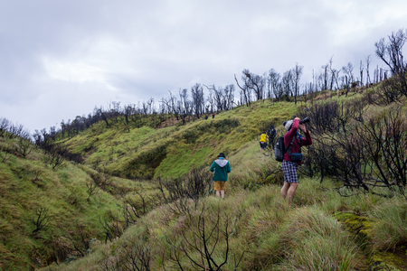 Garut, Indonesia - August 12, 2018 : A group of young people are enjoying and hiking Papandayan Mountain. Papandayan Mountain is one of the favorite place to hike on Garut.のeditorial素材