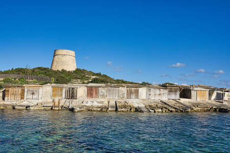 IBIZA, SPAIN, March 2021, round stone tower kind of defensive wall on the Spanish island coastのeditorial素材