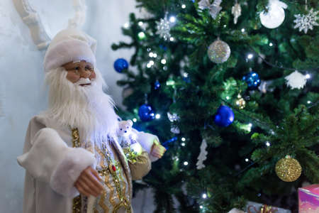 Decorated Christmas tree and gift boxes in the living room. Classic christmasの写真素材