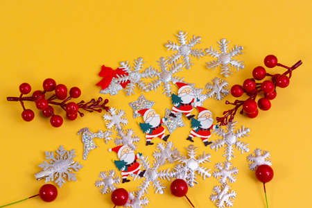 Bauble ornaments on a light beige pastel background. Decorated table for Christmas party